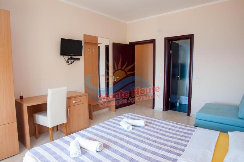 Postel nebo postele na pokoji v ubytování APARTMANI LUX SEA