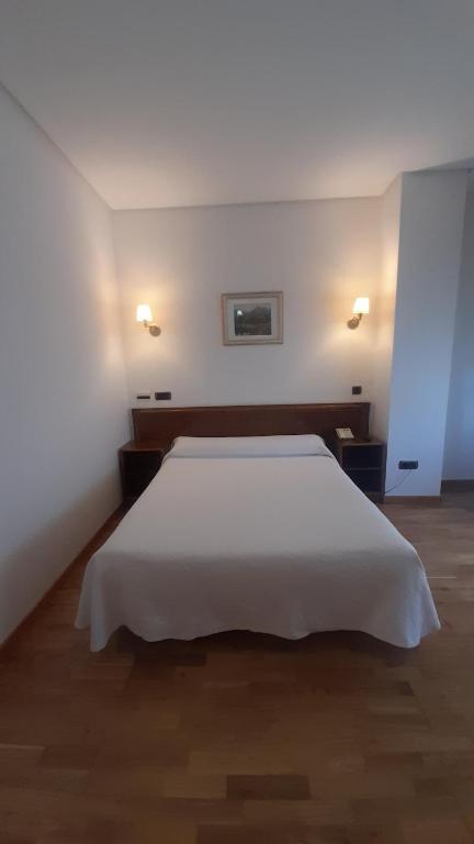 Postel nebo postele na pokoji v ubytování Hotel Las Moreras