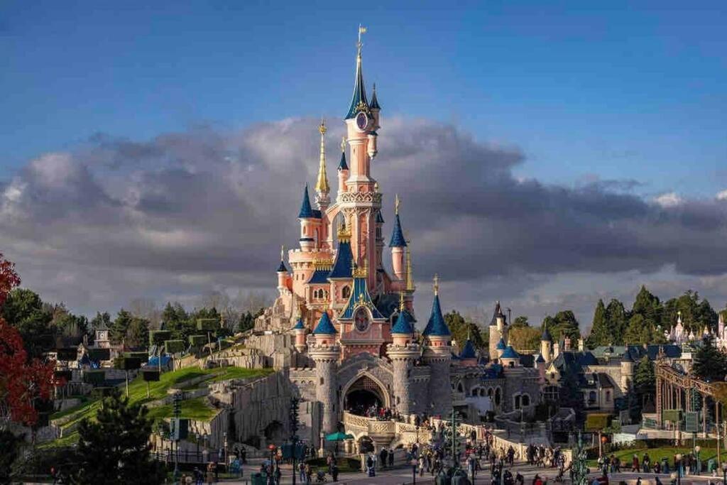 a view of cinderella castle in disney world at Appartement Hermitage à 10 minutes de Disney in Montévrain