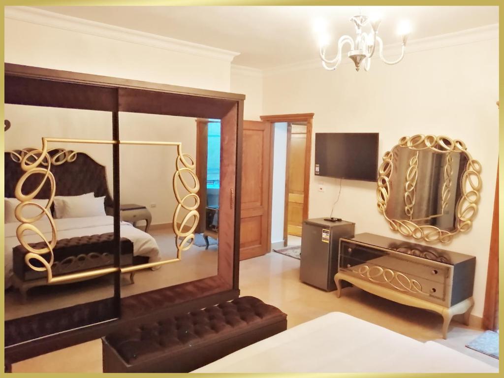 TV a/nebo společenská místnost v ubytování Cairo Taj Hotels & Suites - Dokki