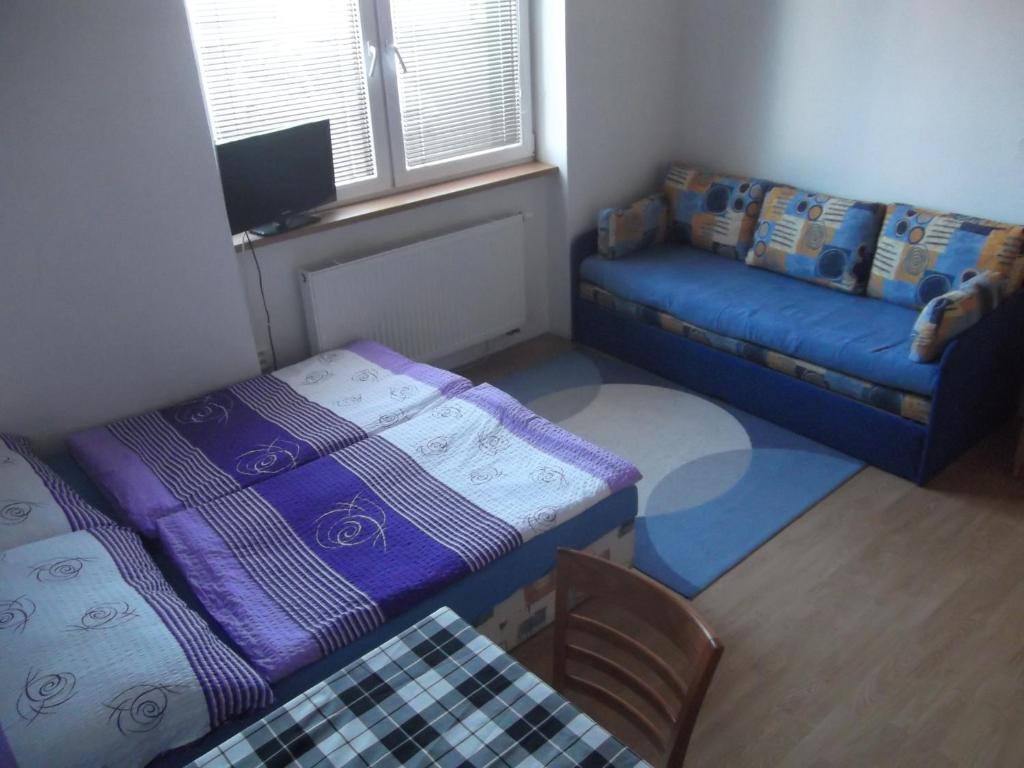 Postel nebo postele na pokoji v ubytování Penzion Apartmány Zlín