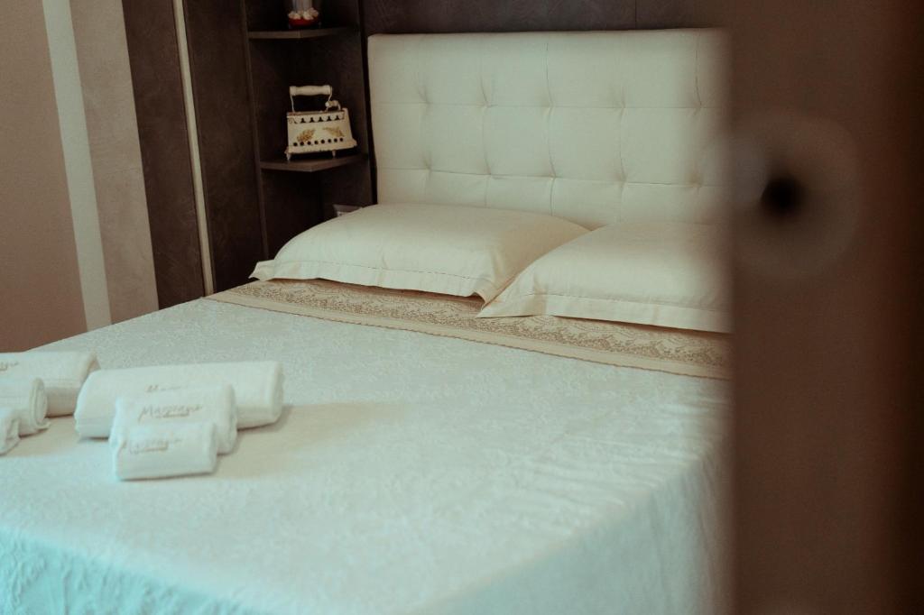 A bed or beds in a room at Massanè Casa Vacanza