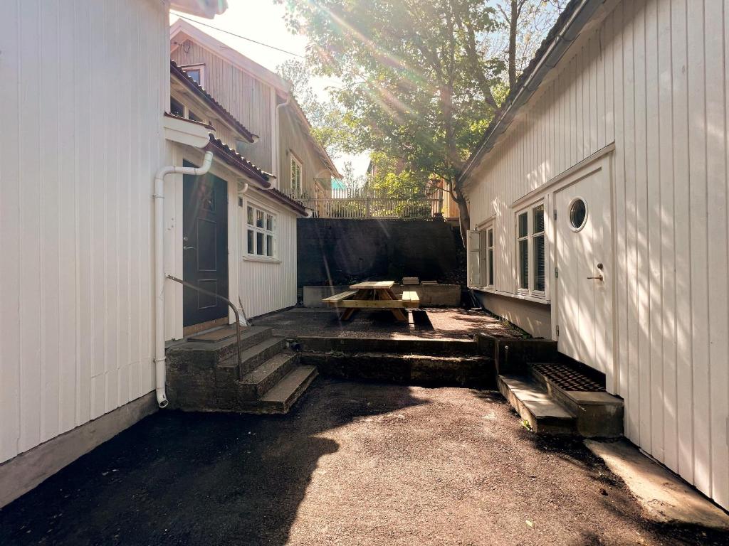 a patio with a picnic table next to a building at Mycondo no - Snorres gt 4b apt 2 - Gratis parkering in Tønsberg