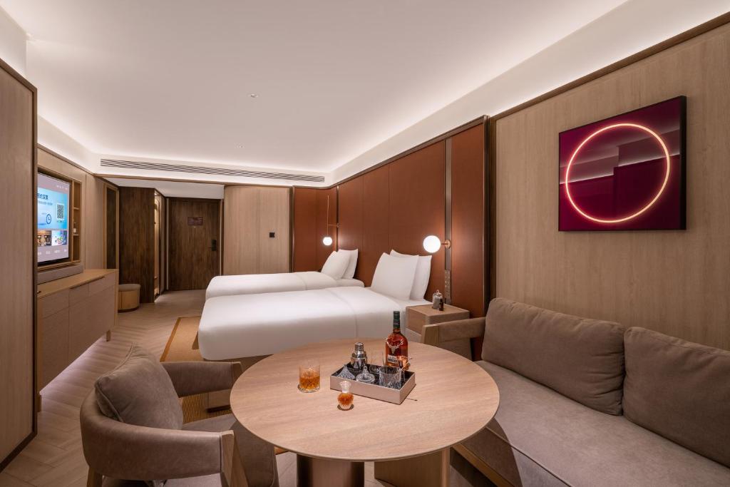Postel nebo postele na pokoji v ubytování Crystal Orange Hotel - Shenzhen Nanshan Xinhaofang Branch