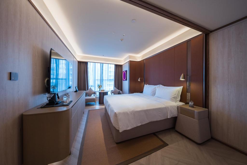 Postel nebo postele na pokoji v ubytování Crystal Orange Hotel - Shenzhen Nanshan Xinhaofang Branch