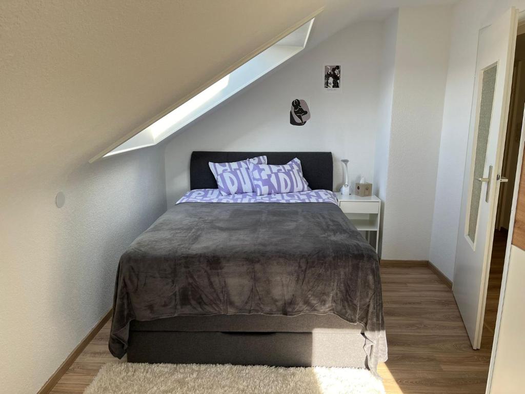 a bedroom with a bed in a stair room at Ferienwohnung in Donaueschingen