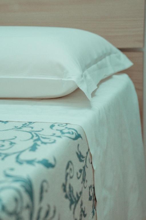 A bed or beds in a room at Massanè Casa Vacanza