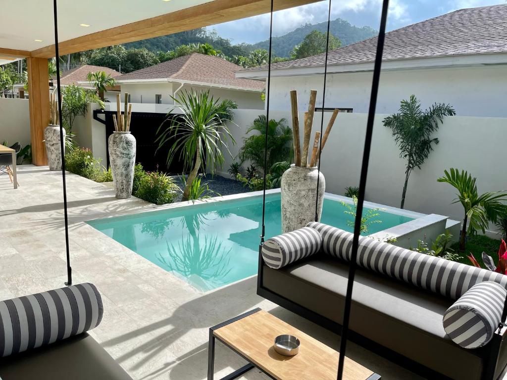a view of a swimming pool from a house at Yuka residence in Koh Samui