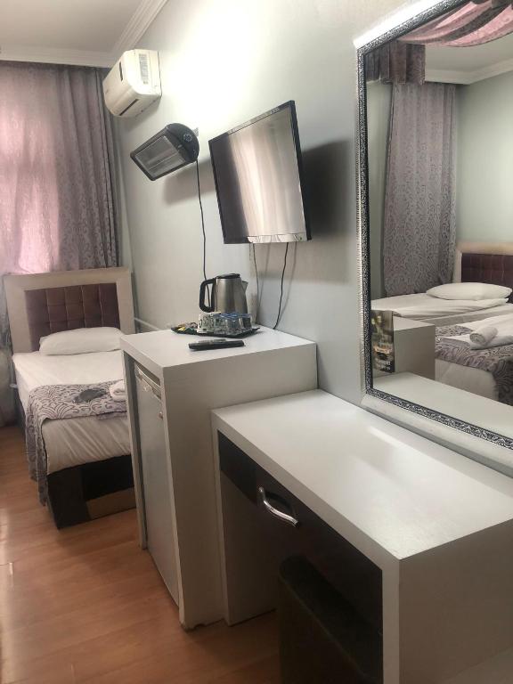 Postel nebo postele na pokoji v ubytování SRF Hotel