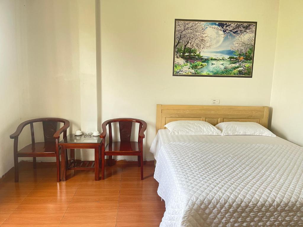 Postel nebo postele na pokoji v ubytování Van Anh Hotel