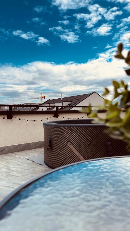 a swimming pool with a view of a building at Skylark - Monaco Penthouse with Jacuzzi & Panoramic View in Braşov