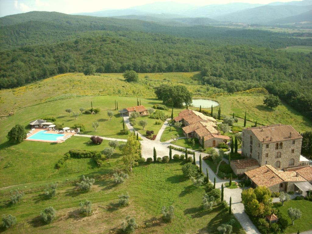 an aerial view of an estate with a swimming pool and a house at Il Convento di Monte Pozzali in Massa Marittima