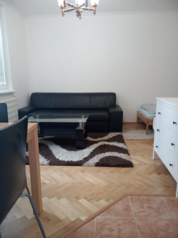 a living room with a couch and a coffee table at Bibi Apartment in Martin