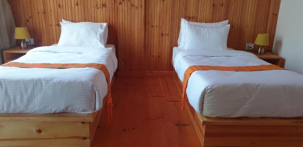 Postel nebo postele na pokoji v ubytování Om Amriti