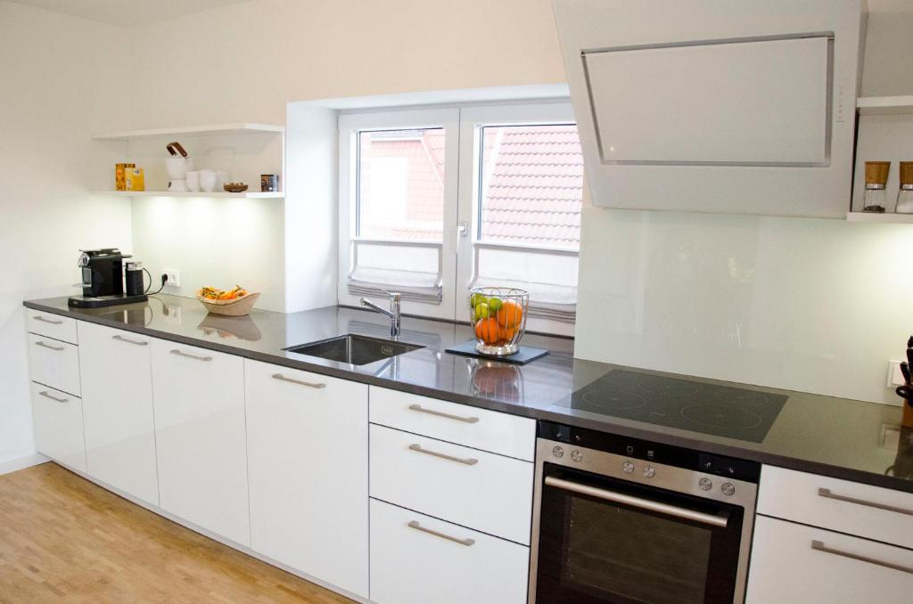 Kuchyň nebo kuchyňský kout v ubytování Haus129
