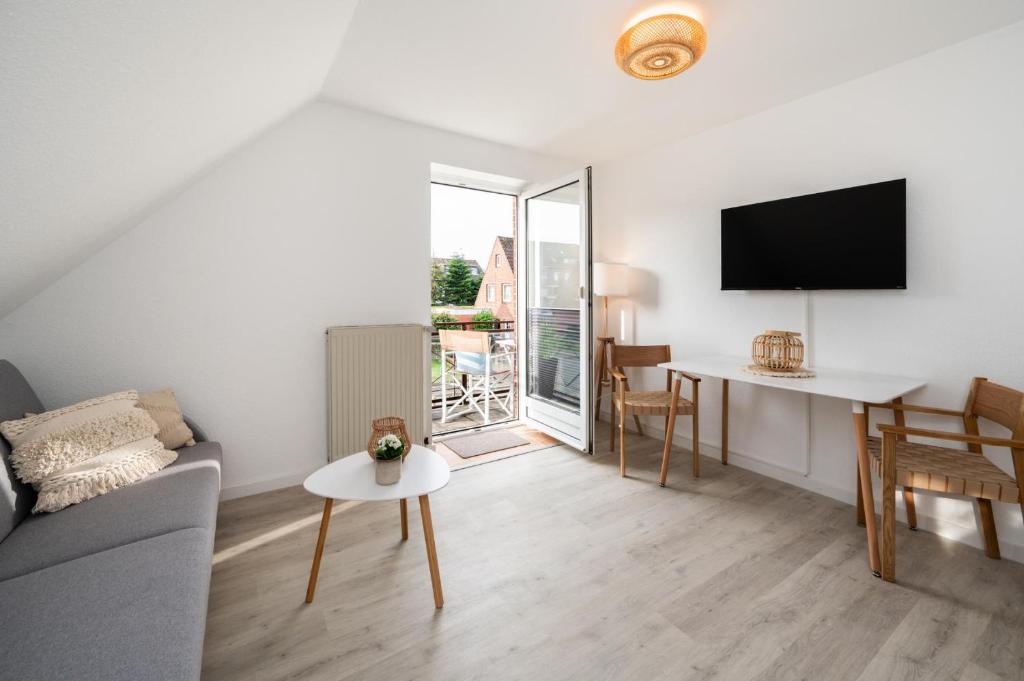 TV a/nebo společenská místnost v ubytování Perlebüdchen