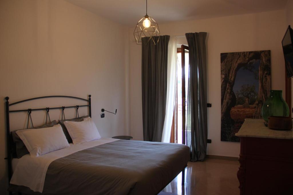 Łóżko lub łóżka w pokoju w obiekcie B&B Le Terrazze Lama Balice