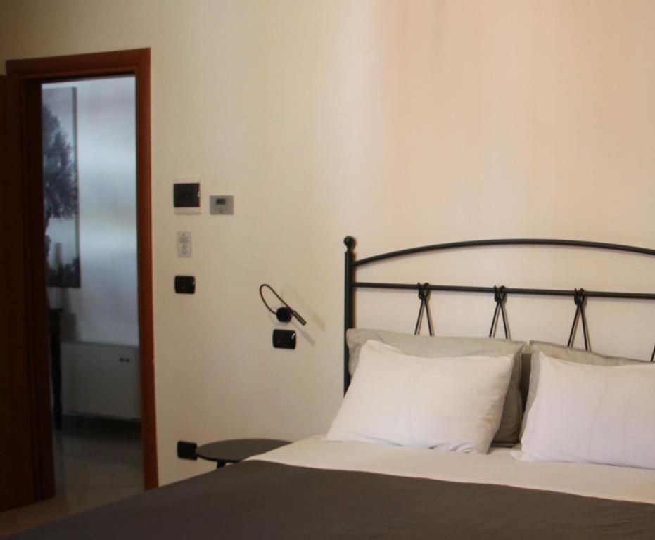 Łóżko lub łóżka w pokoju w obiekcie B&B Le Terrazze Lama Balice