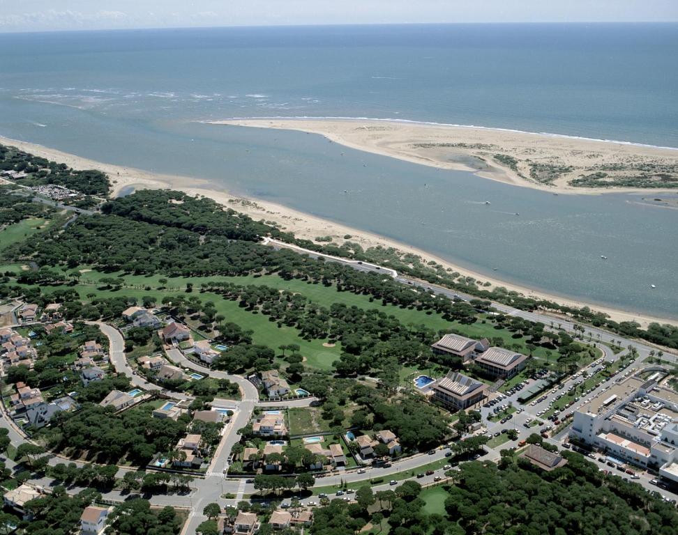 an aerial view of a park next to a beach at Hotel Nuevo Portil Golf in El Rompido