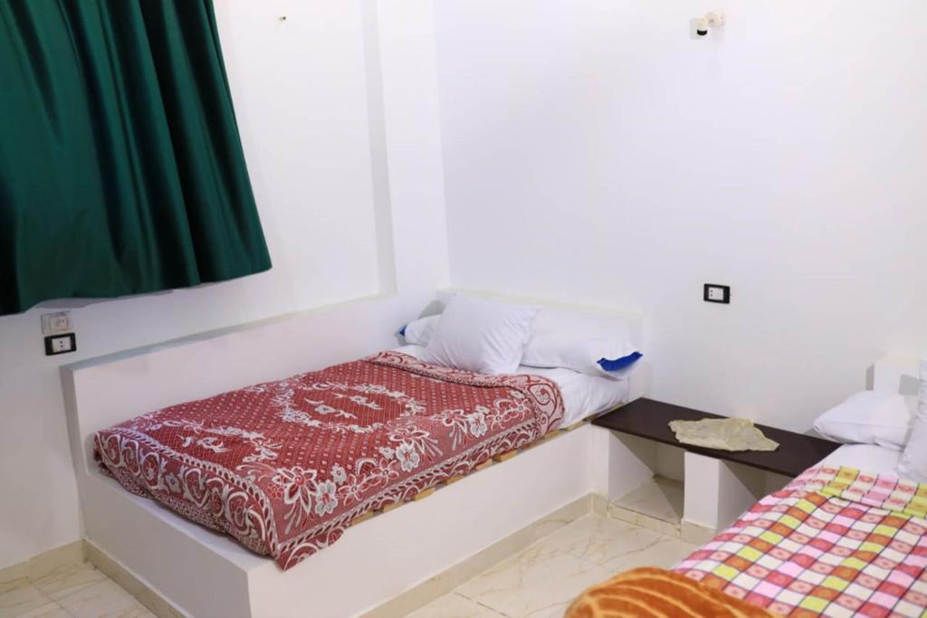 Postel nebo postele na pokoji v ubytování Magic Place Luxor