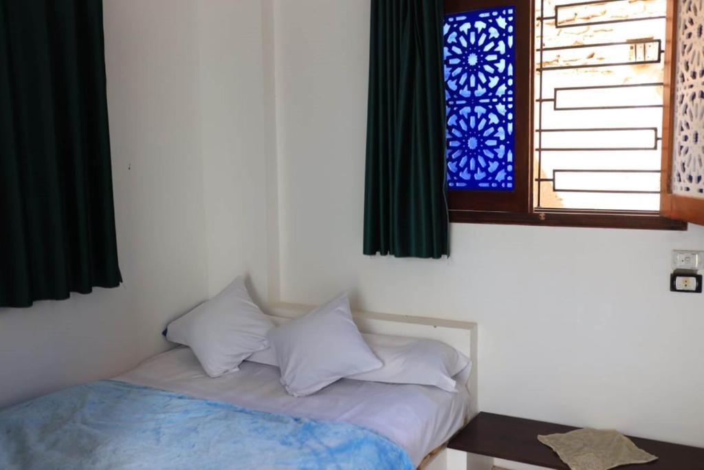 Postel nebo postele na pokoji v ubytování Magic Place Luxor