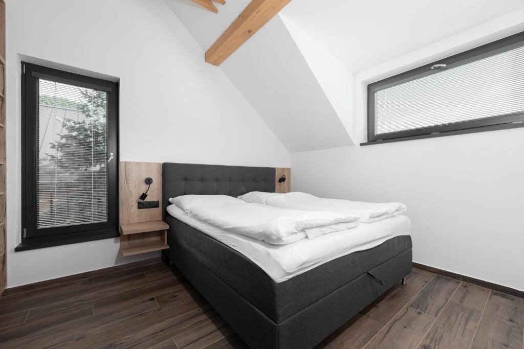 Postel nebo postele na pokoji v ubytování Apartmány HAFERKY Velké Karlovice