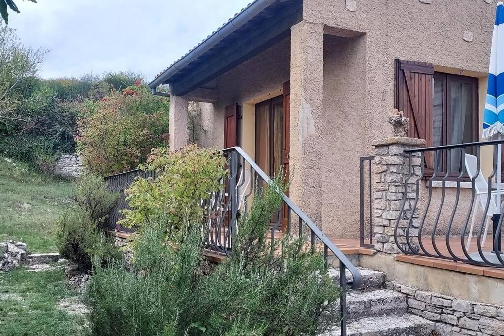 a house with a staircase leading to a balcony at Villa Maison de campagne 04 Vacheres Luberon 3 chambres 8 personnes in Vachères