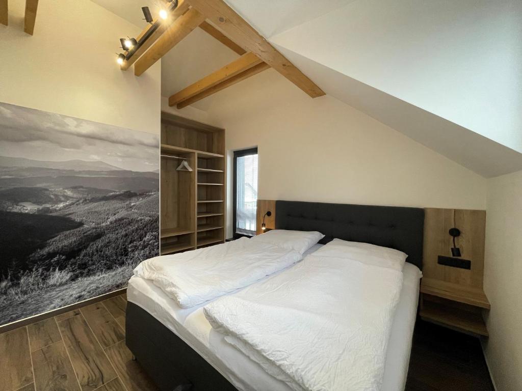 Postel nebo postele na pokoji v ubytování Apartmány HAFERKY Velké Karlovice