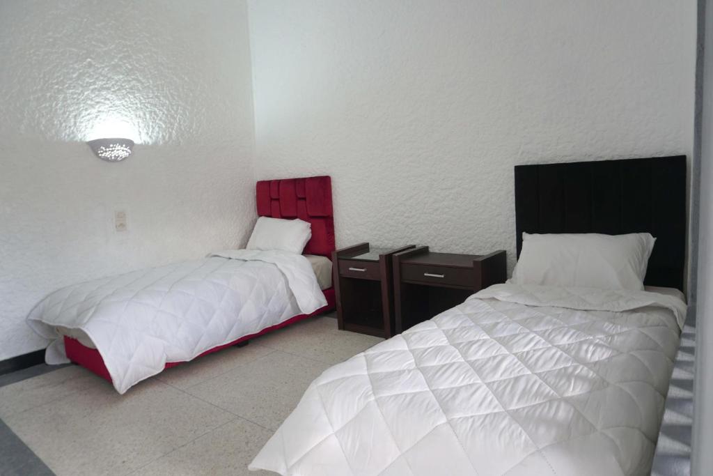 Postel nebo postele na pokoji v ubytování Hotel Warda