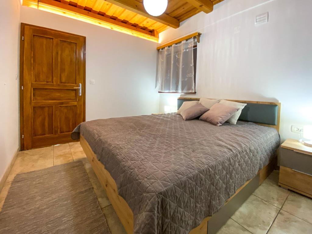 Postel nebo postele na pokoji v ubytování Apartment Feher Lendava