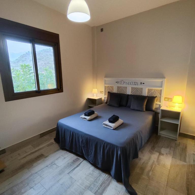 Posteľ alebo postele v izbe v ubytovaní Casa Rural Sierra De Las Nieves