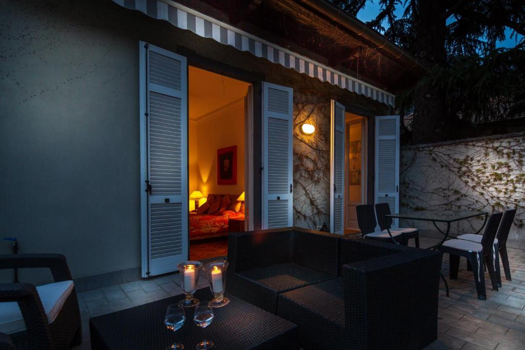 a patio with a table and some candles on it at Villa Cernobbio in Cernobbio