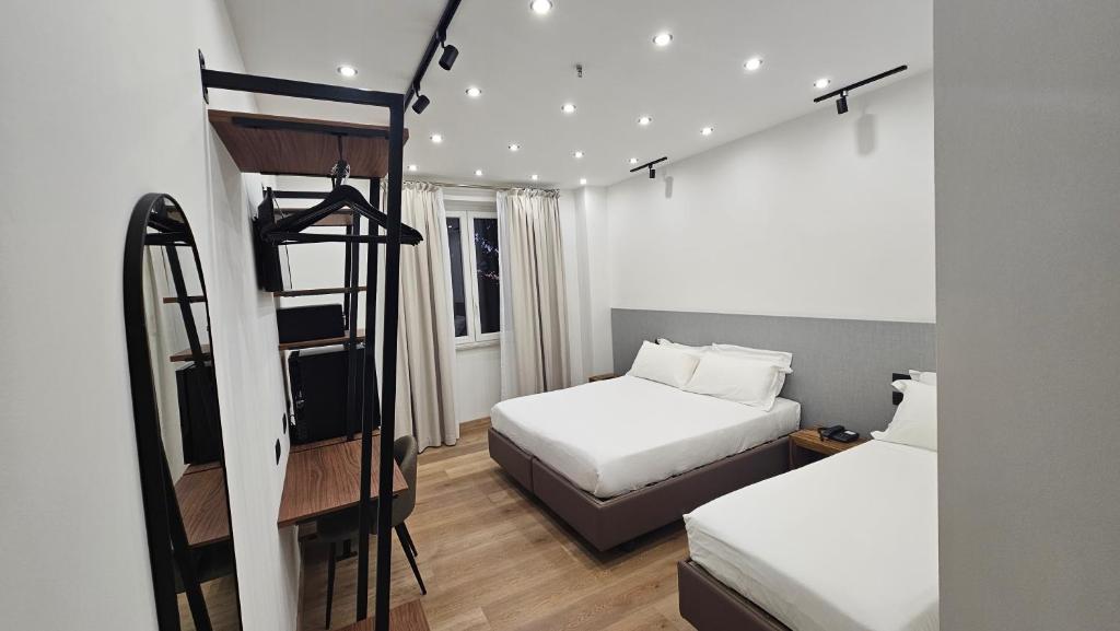 Postel nebo postele na pokoji v ubytování Hotel La Superba