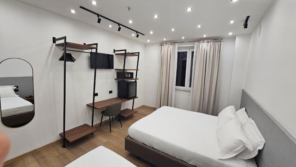 Postel nebo postele na pokoji v ubytování Hotel La Superba