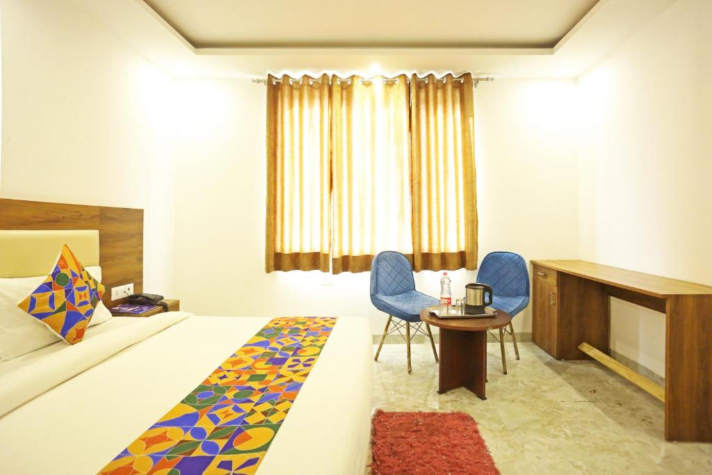 Postel nebo postele na pokoji v ubytování Hotel De Clark Residency Delhi Airport