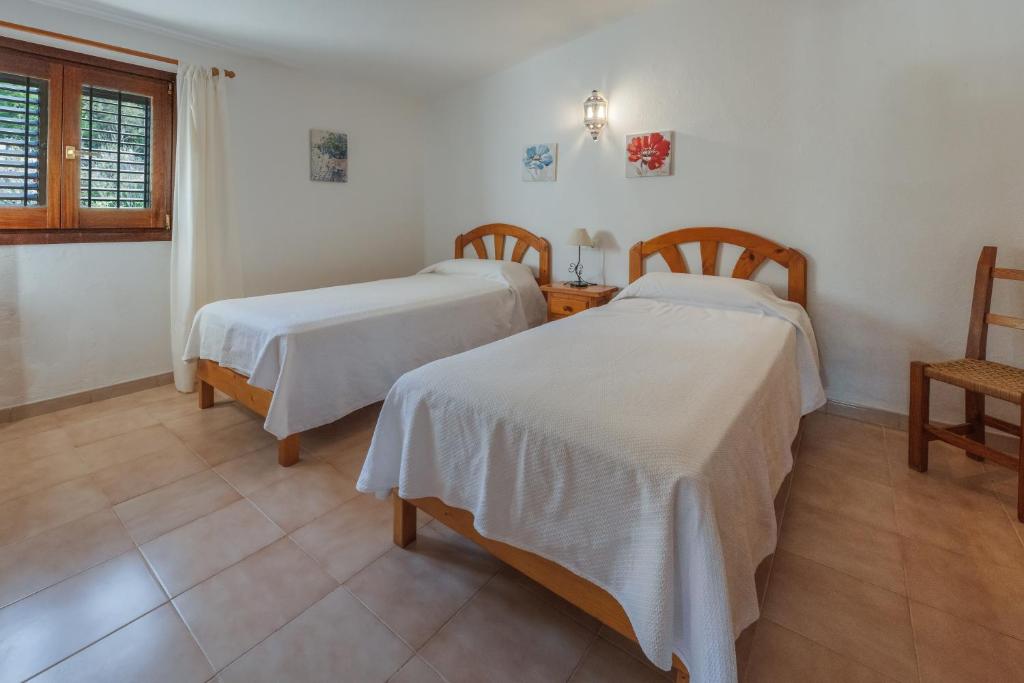 Posteľ alebo postele v izbe v ubytovaní VILLA GREAT PARADISE