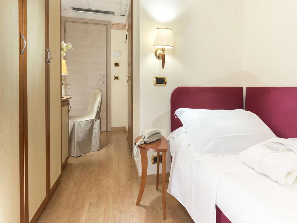 Postel nebo postele na pokoji v ubytování Hotel Bikini