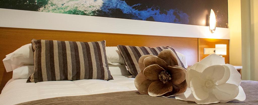 Postel nebo postele na pokoji v ubytování Hotel Bello