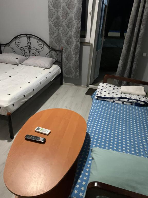 Postel nebo postele na pokoji v ubytování Гостиный Дом Comfort