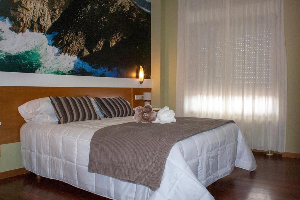 Postel nebo postele na pokoji v ubytování Hotel Bello