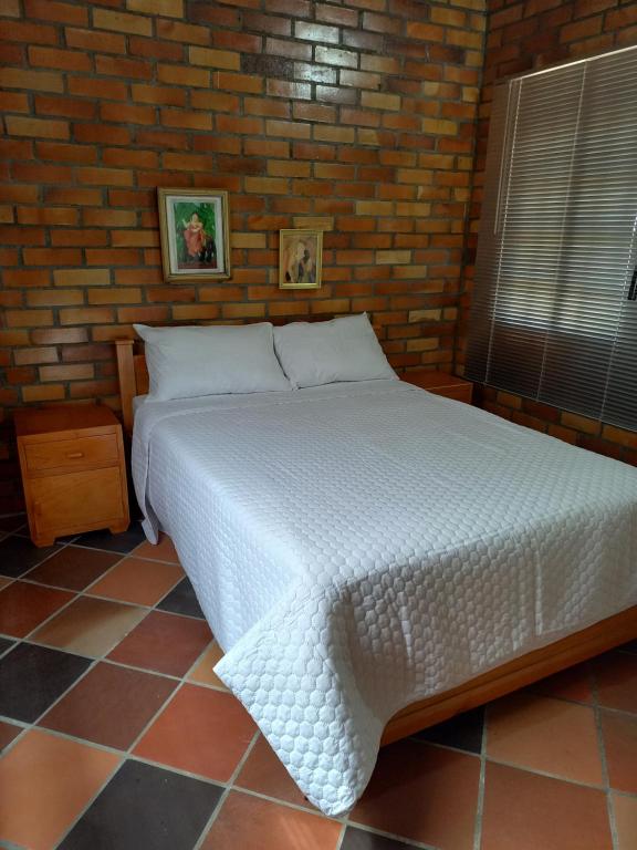 Postel nebo postele na pokoji v ubytování Cabañas GARUTO