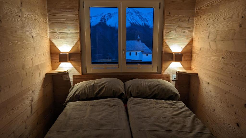 Una cama o camas en una habitación de Imhof Alpine B&B Apartments