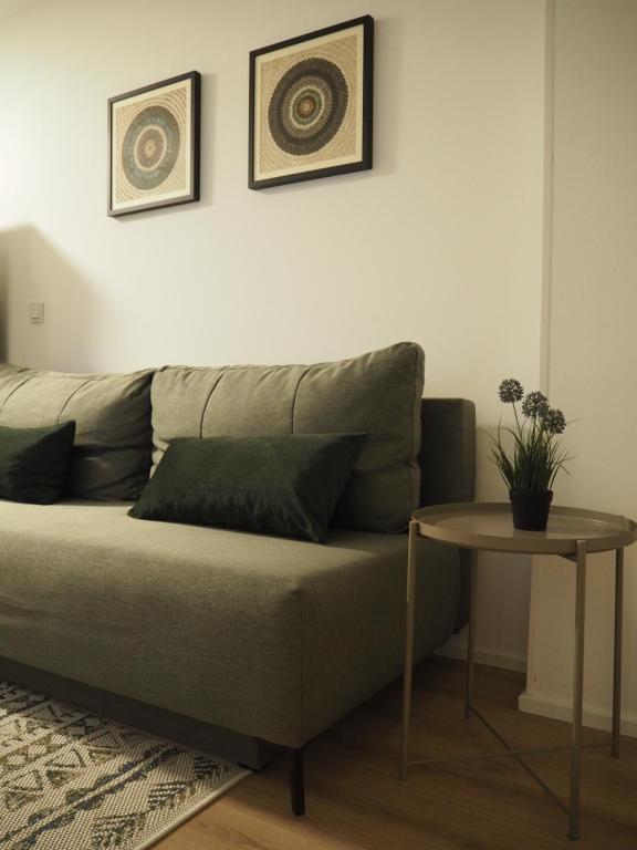 a couch in a living room with a table at Apartment Simon in Zagreb