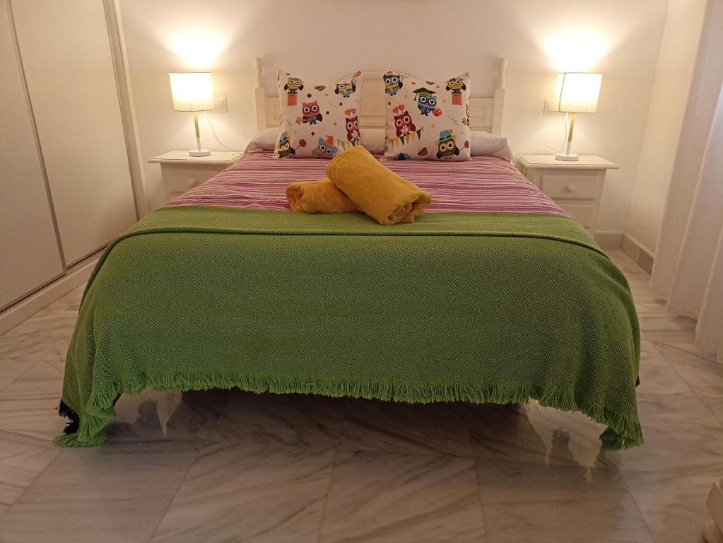 Rúm í herbergi á Apartamento Exclusivo - María 7