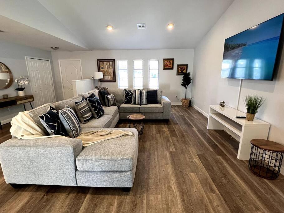 a living room with two couches and a tv at New! Fully Renovated 3/2 Luxury Vacation Home in Venice