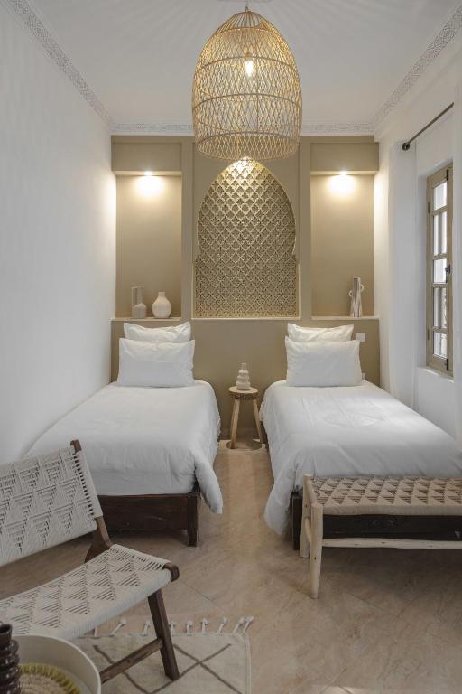 Postel nebo postele na pokoji v ubytování M-17 Riad & Spa