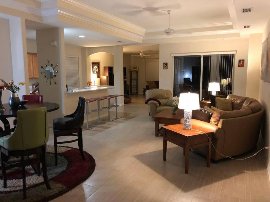a living room with a couch and a table at Golfer’s Paradise 3/2 Luxury Vacation Home in Bradenton