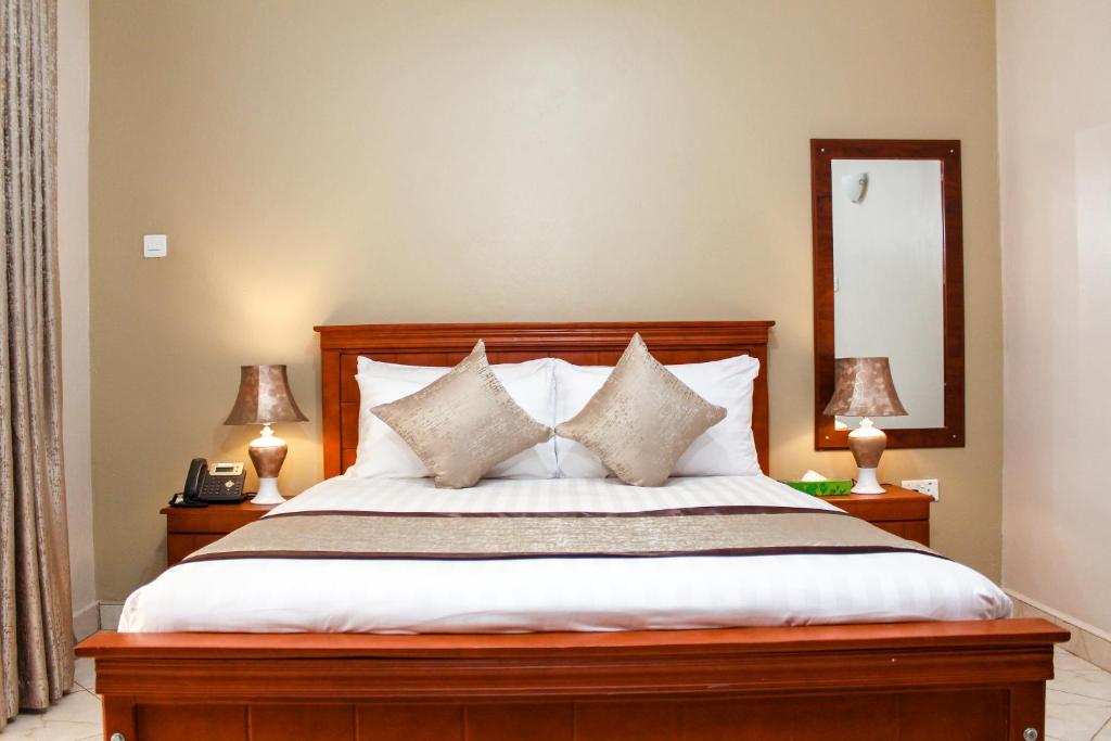 Postel nebo postele na pokoji v ubytování Excelsis Garden Hotels - Kampala
