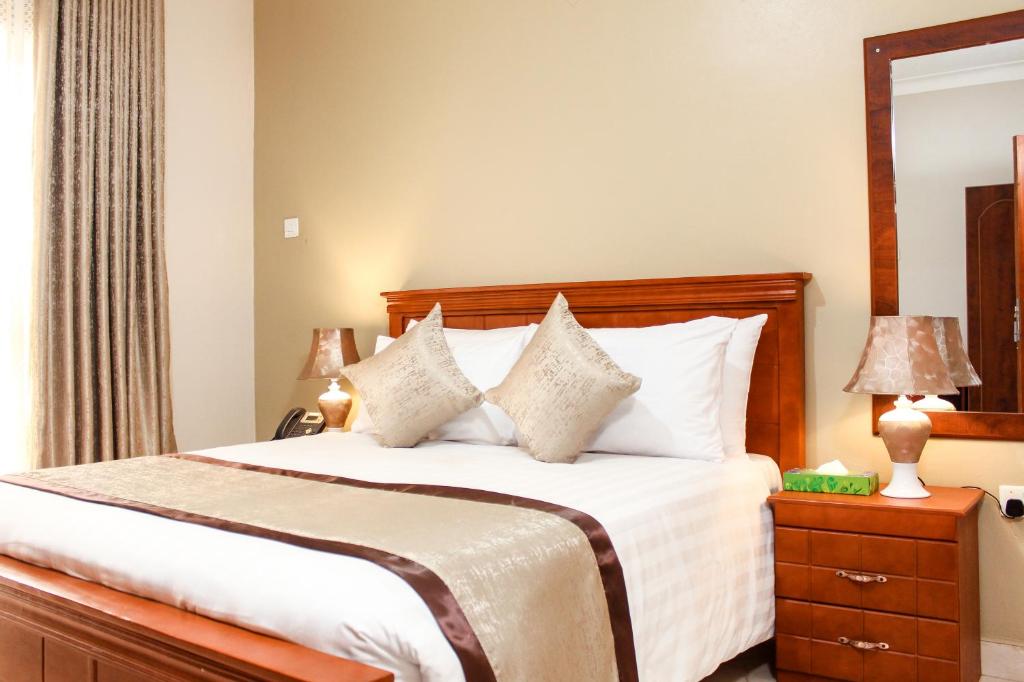 Postel nebo postele na pokoji v ubytování Excelsis Garden Hotels - Kampala
