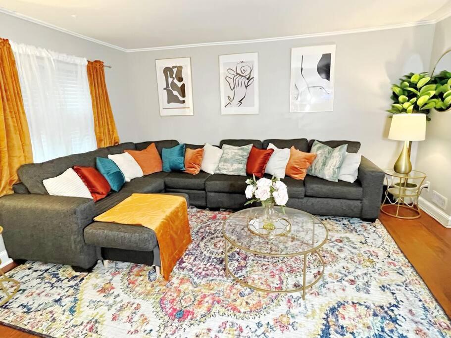 a living room with a couch and a table at Towson Center BNB in Towson